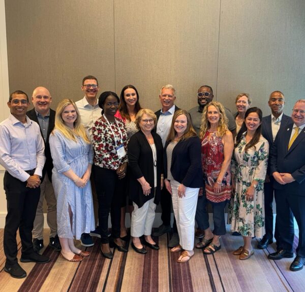 A group photo of the ACHA Board of Directors at a conference
