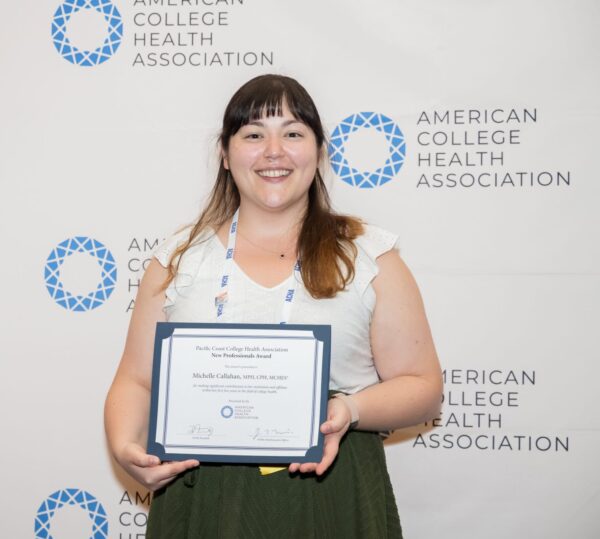 Professional person holding an award certificate