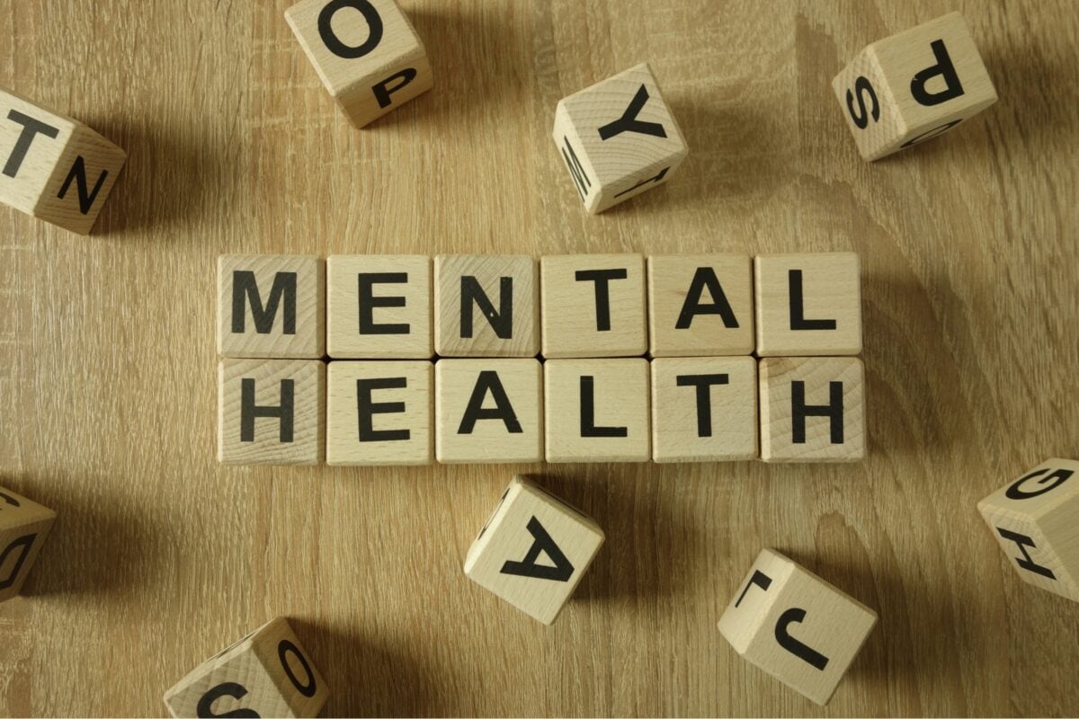 Letter blocks on a table spelling out Mental Health