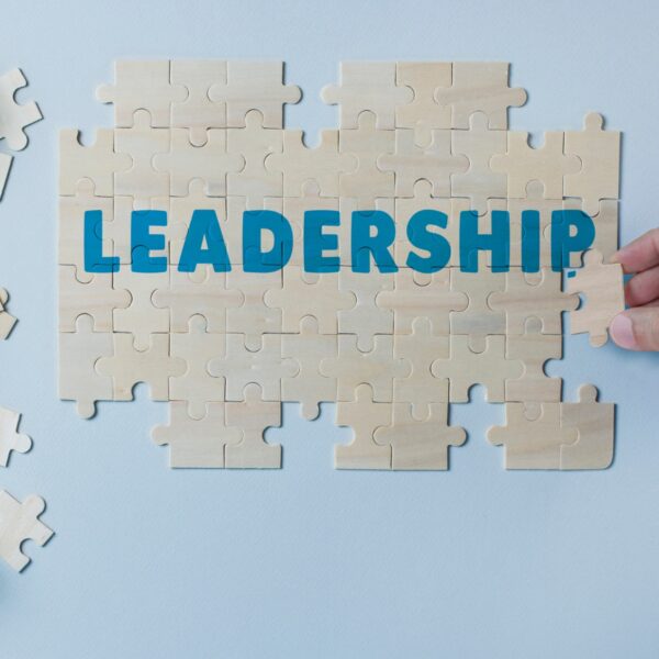Puzzle pieces coming together to spell out leadership