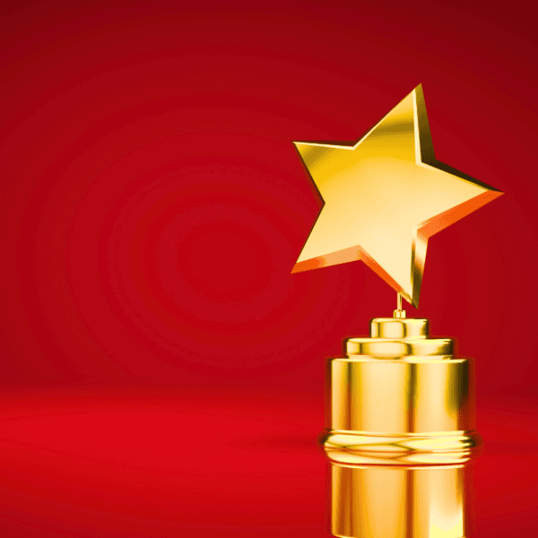 A star-shaped trophy on a red background