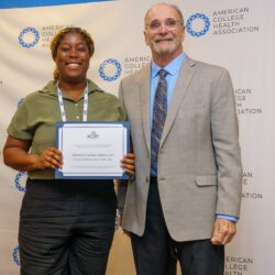 Award recipient Aderinola Omolade-Adunbi posing with ACHF chair Mike Huey