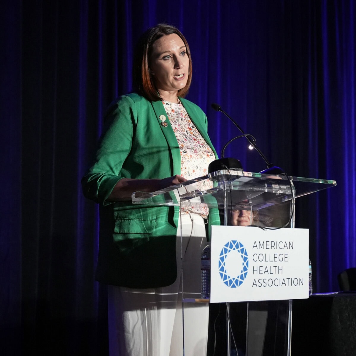 ACHA President Andreea Baker speaking at the ACHA 2026 Annual Meeting