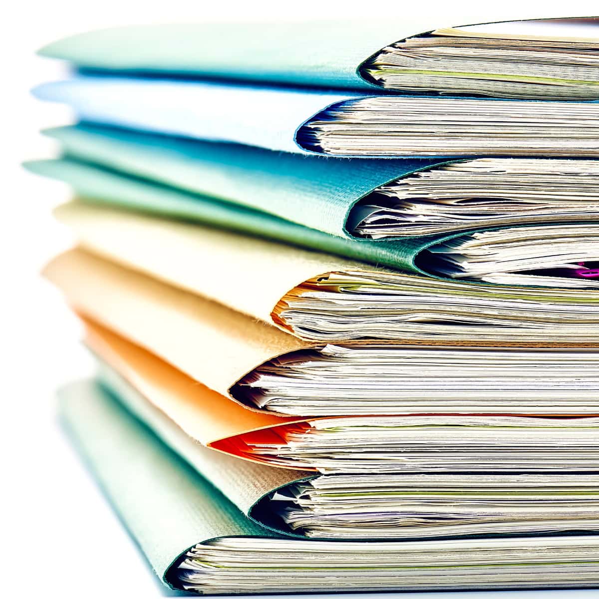 A stack of files organized in folders of many different colors