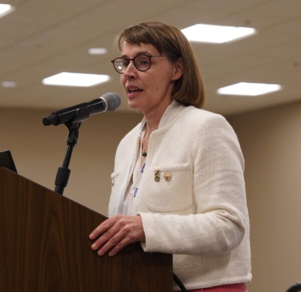 Sarah Van Orman at the podium giving an acceptance speech