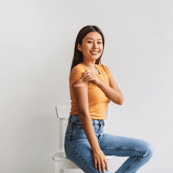 happy college student who just received a vaccine