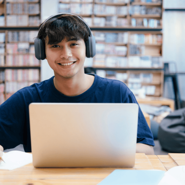 Happy college student learning online