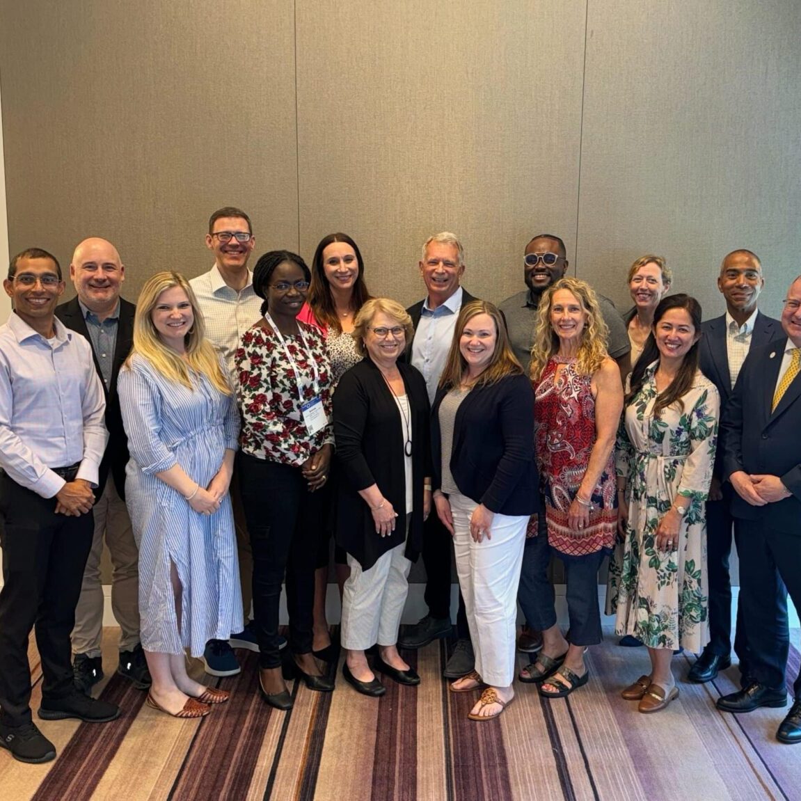A group photo of the ACHA Board of Directors at a conference