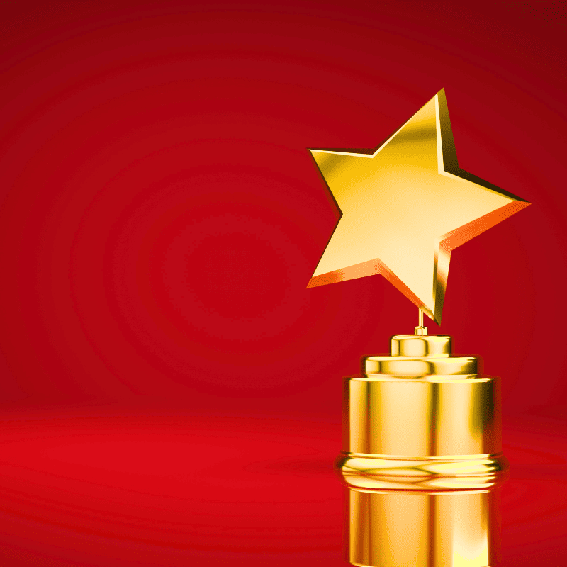 A star-shaped trophy on a red background