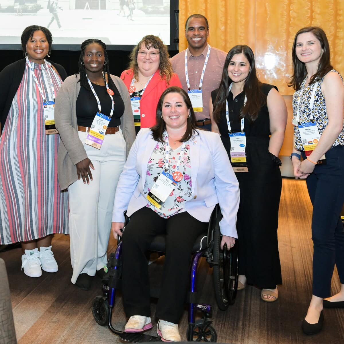 A diverse group of ACHA Annual Meeting presenters gathered together and smiling