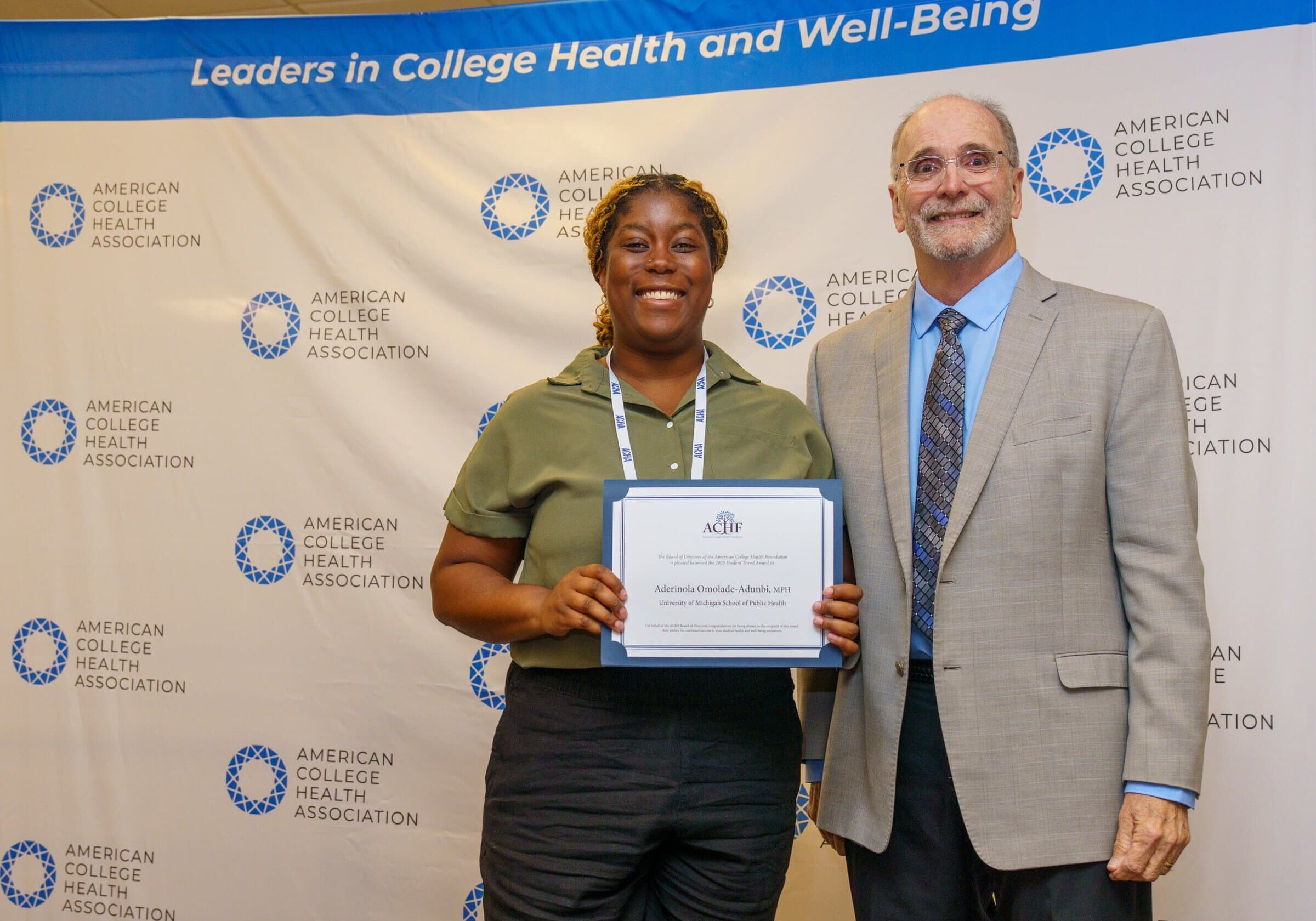 Award recipient Aderinola Omolade-Adunbi posing with ACHF chair Mike Huey
