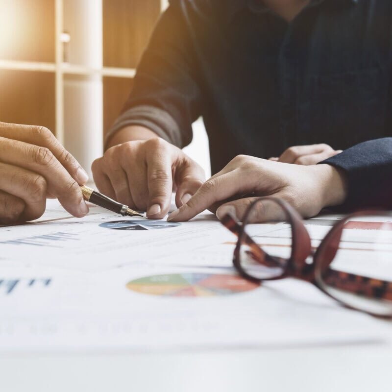 Group of business. Business Team adviser busy discussing financial matter during meeting Business people pointing at financial data Business meeting Concept