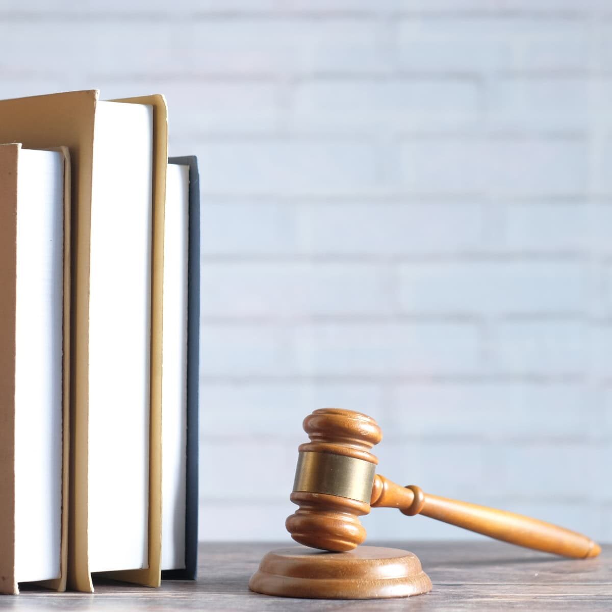 Books on a table along with a gavel