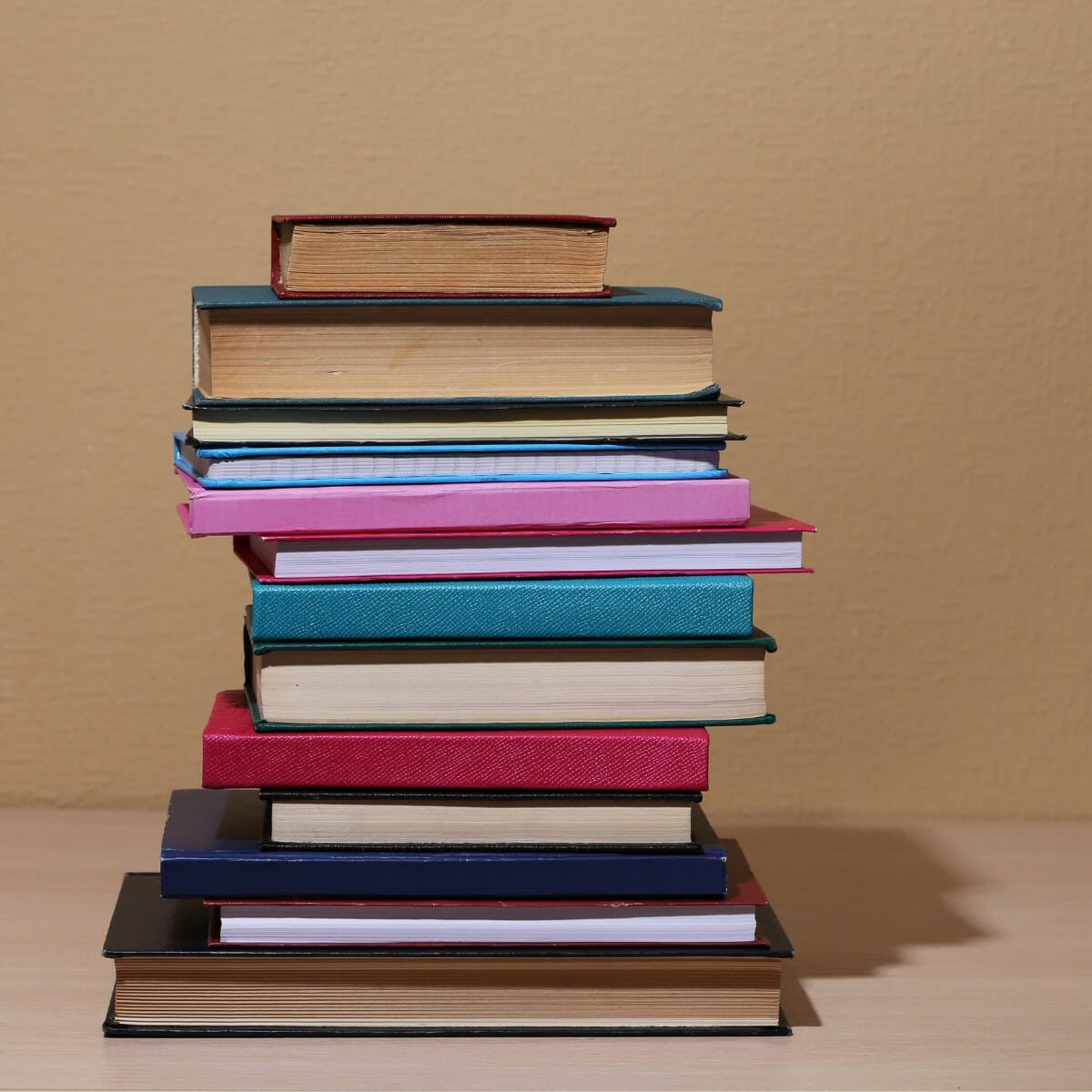 A stack of books of various sizes