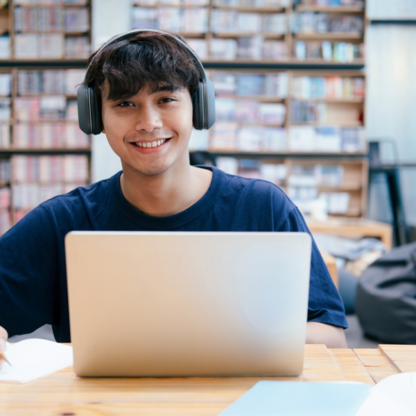 Happy college student learning online