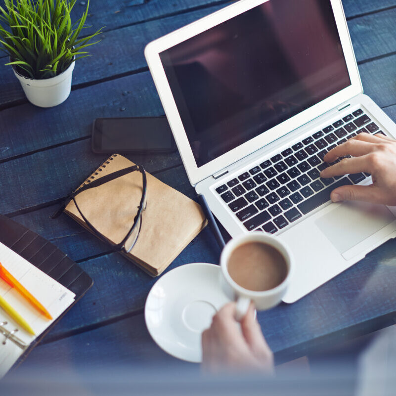 Businessman working with laptop at office table