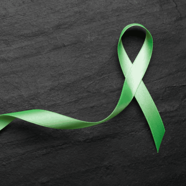 Green ribbon symbolizing support for mental health awareness